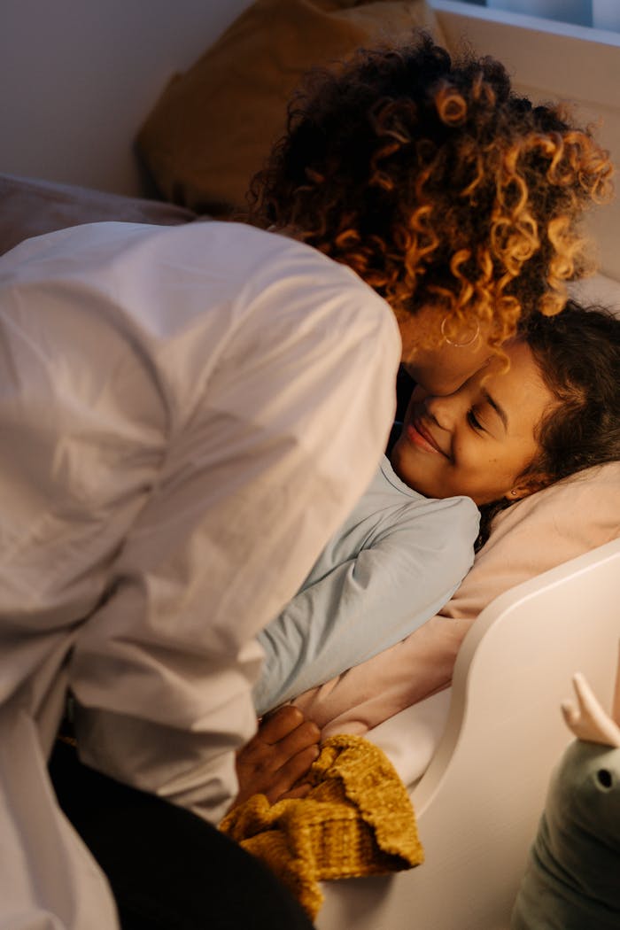 services-02 A tender moment between a mother and daughter, showcasing love and warmth before bedtime.